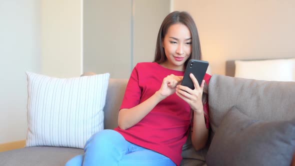 Young asian woman use smart phone