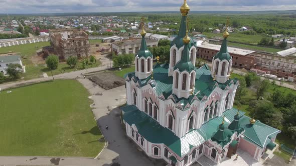 Aerial view monastery surrounded by a brick wall on the edge of the Dalmatovo city 13 alt