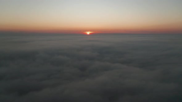 Video over а morning calm sea with low clouds