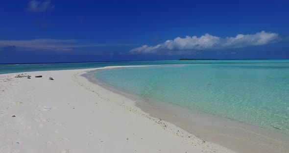 Daytime above abstract shot of a white sand paradise beach and blue sea background in high resolutio