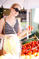 Young woman shopping for fresh tomatoes - PhotoDune Item for Sale