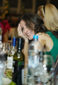 Happy smiling woman sitting at a bar counter - PhotoDune Item for Sale