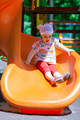 Small girl having fun on a slide - PhotoDune Item for Sale