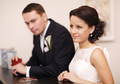 Couple at a reception desk with their passports - PhotoDune Item for Sale