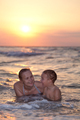 Mother enjoying an evening swim with her son - PhotoDune Item for Sale