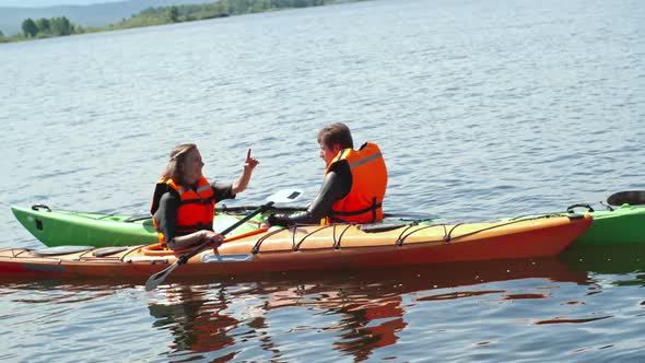 Kayakers Chatting on Water