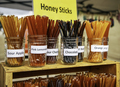 Honey sticks on display. Farmer market - PhotoDune Item for Sale