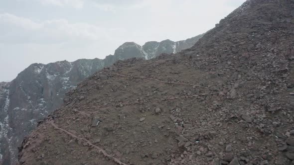 Aerial reveal around cliff face of Pikes Peak, Colorado, USA