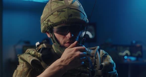 Soldier Talking Into a Walkie-talkie