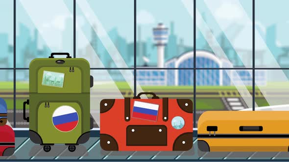 Suitcases with Russian Flag Stickers on Baggage Carousel