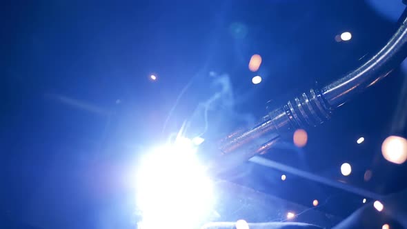 A Welding Process at a Plant. Welding Sparks, Slow Motion.