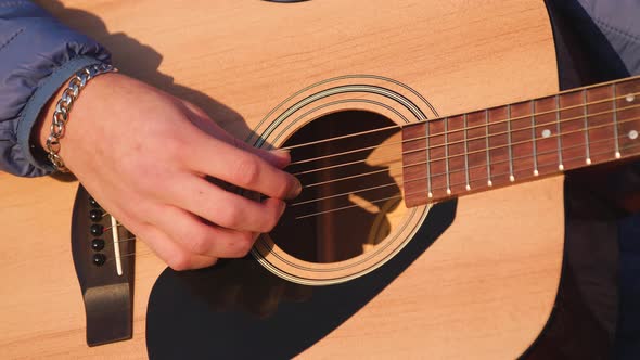 Man playing guitar with slow motion shoot music musician classic chord acoustic