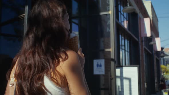 Tranquil Girl Going with Ice Cream Closeup