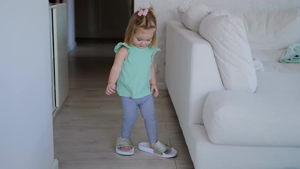 Infant Girl Wearing Mothers Shoes