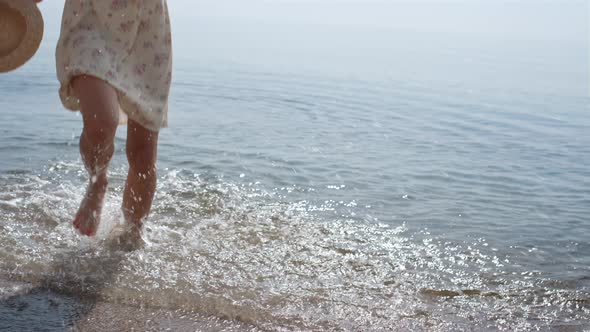 Unknown Carefree Lady Running on Sea Waves in Slow Motion