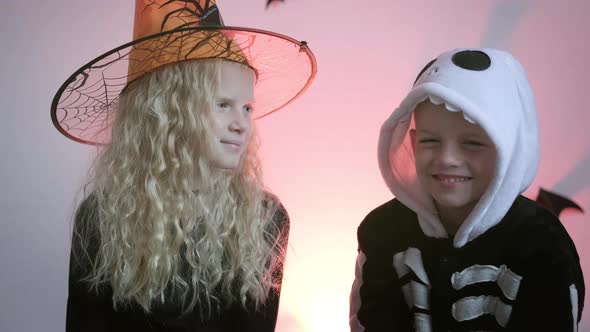 Halloween Kids Portrait Brother and Sister in Halloween Costume at Home