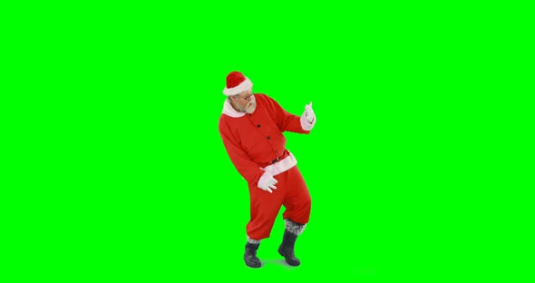 Santa claus dancing against green background