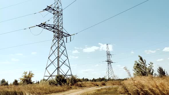 Electricity Transportation Industry Energetics. Power Lines And Blue Sky Time Lapse. High Voltage.