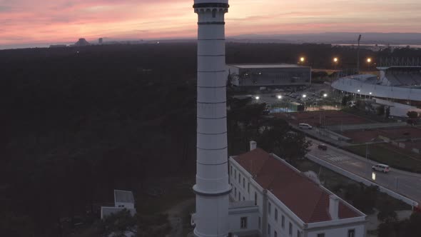 Aerial drone video of Vila Real de Santo Antonio city, lighthouse farol and stadium in Portugal