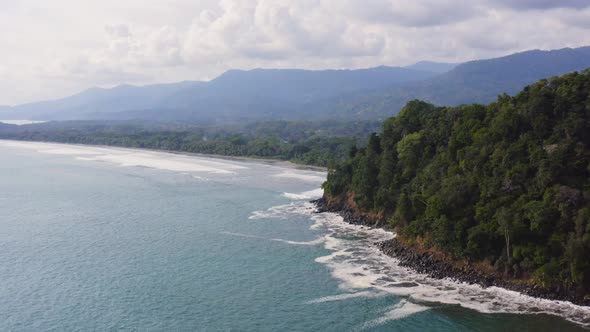 Aerial Drone View of Rainforest and Ocean on the Pacific Coast in Costa Rica, Tropical Jungle Coasta