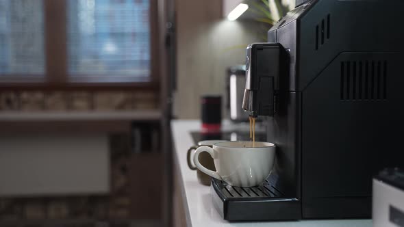 Automatic Coffee Machine Makes a Cup of Morning Coffee