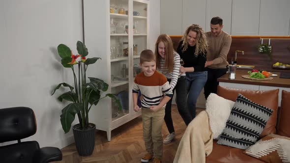 Joyful Mute Family Having Fun During Leisure Time