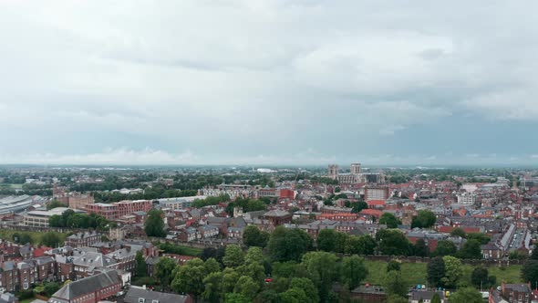 wide rising drone shot of York city centre cloudy day