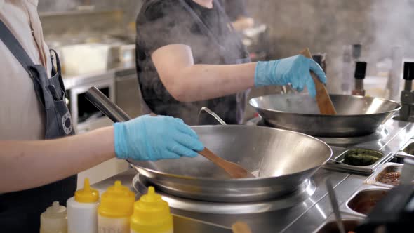 Tortiglioni Cazarece Spaghetti Pasta Falling From a Spout As They Travel Along the Production Line