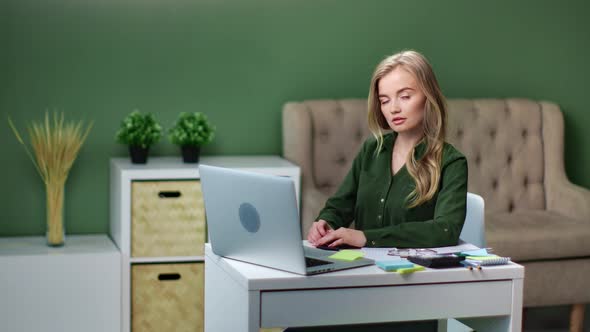 Beautiful Female Remote Employee at Work Table with Computer Pc