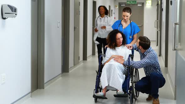 Doctors rushing pregnant woman to the emergency room