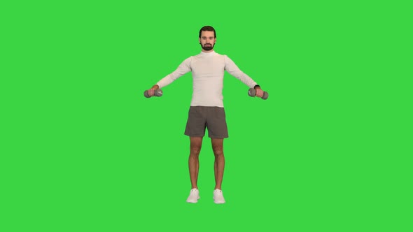 Man Doing Shoulder Lateral Raises on a Green Screen Chroma Key