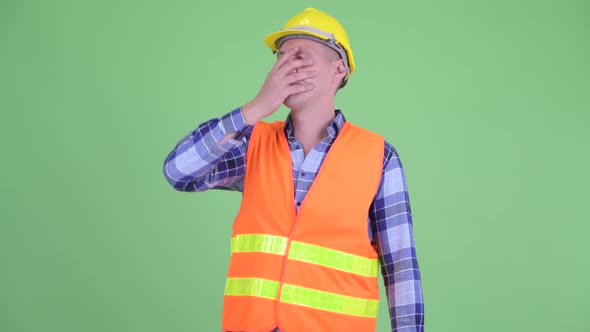 Stressed Young Man Construction Worker Getting Bad News