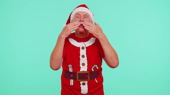 Senior Christmas Grandfather Sending Lots of Air Kisses Looking at Camera Smiling Missing you Love