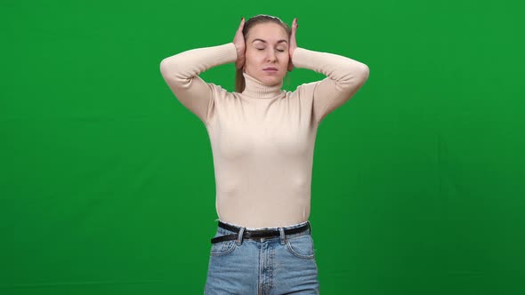 Irritated Woman Closing Ears with Hands Shaking Head No