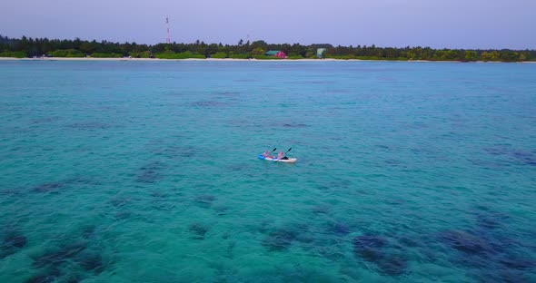 Luxury aerial abstract shot of a white sand paradise beach and blue sea background in colorful 4K