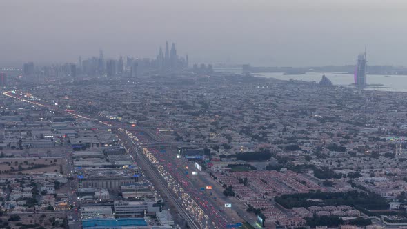 Aerial View to Traffic on Sheikh Zayed Road and Intersection Day to Night Timelapse Dubai United