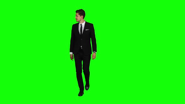 Man Is Going To a Business Meeting and Waving Greetings. Green Screen