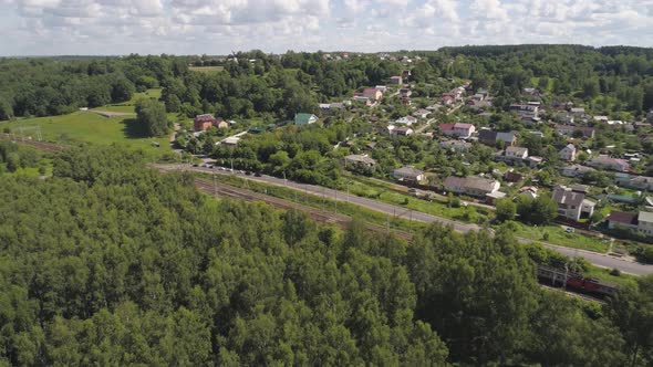 Highway with Cars and a Railway with a Train.