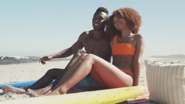 African American couple enjoying sea view