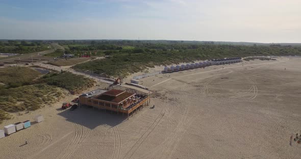 Aerial: A beach club on a large beach in the Netherlands.