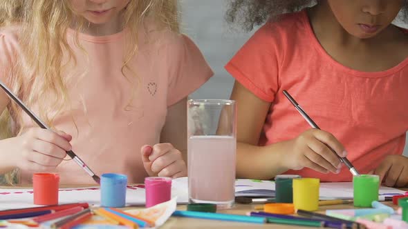 Pair of Adorable Kids Drawing Paintings for Charity Purposes, Philanthropy