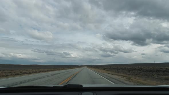 Driving Car in Wyoming Prairie