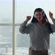 Slow Motion of Asian Woman Wearing Headphones Dancing Having Fun at Home Against Panoramic Window - VideoHive Item for Sale