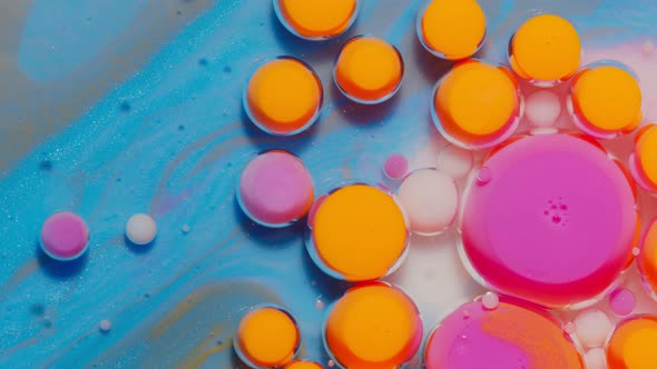 Bright Neon Colorful Bubbles Oil and Ink Acrylic Paint Moving Closeup Wallpaper Background