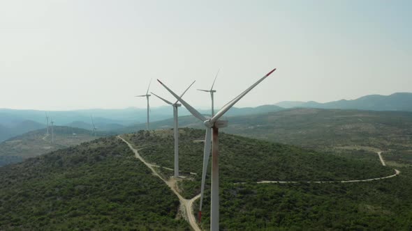 Aerial View of Industrial Windmills in the Mountains