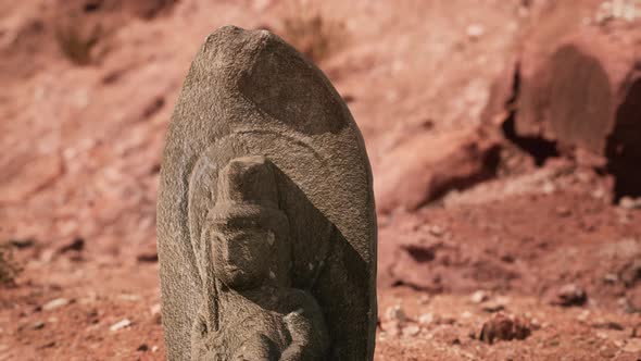 Ancient Statue on the Rocks Desert