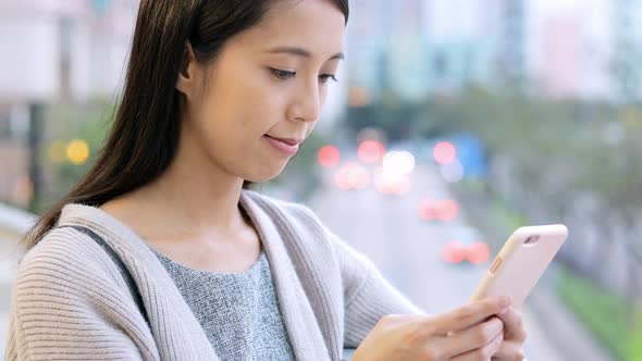 Asian Woman use of cellphone 