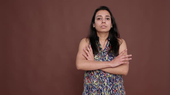 Portrait of Indian Woman Posing with Arms Crossed on Camera