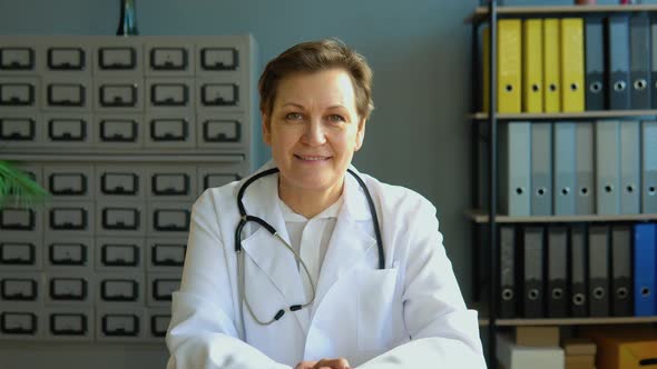 Portrait of a Senior Female Doctor Sitting in Her Office