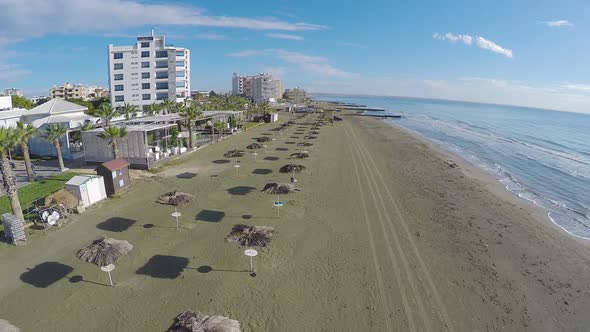 Cool View on Empty Beach with Palms in Larnaca City Cyprus Aerial Shot